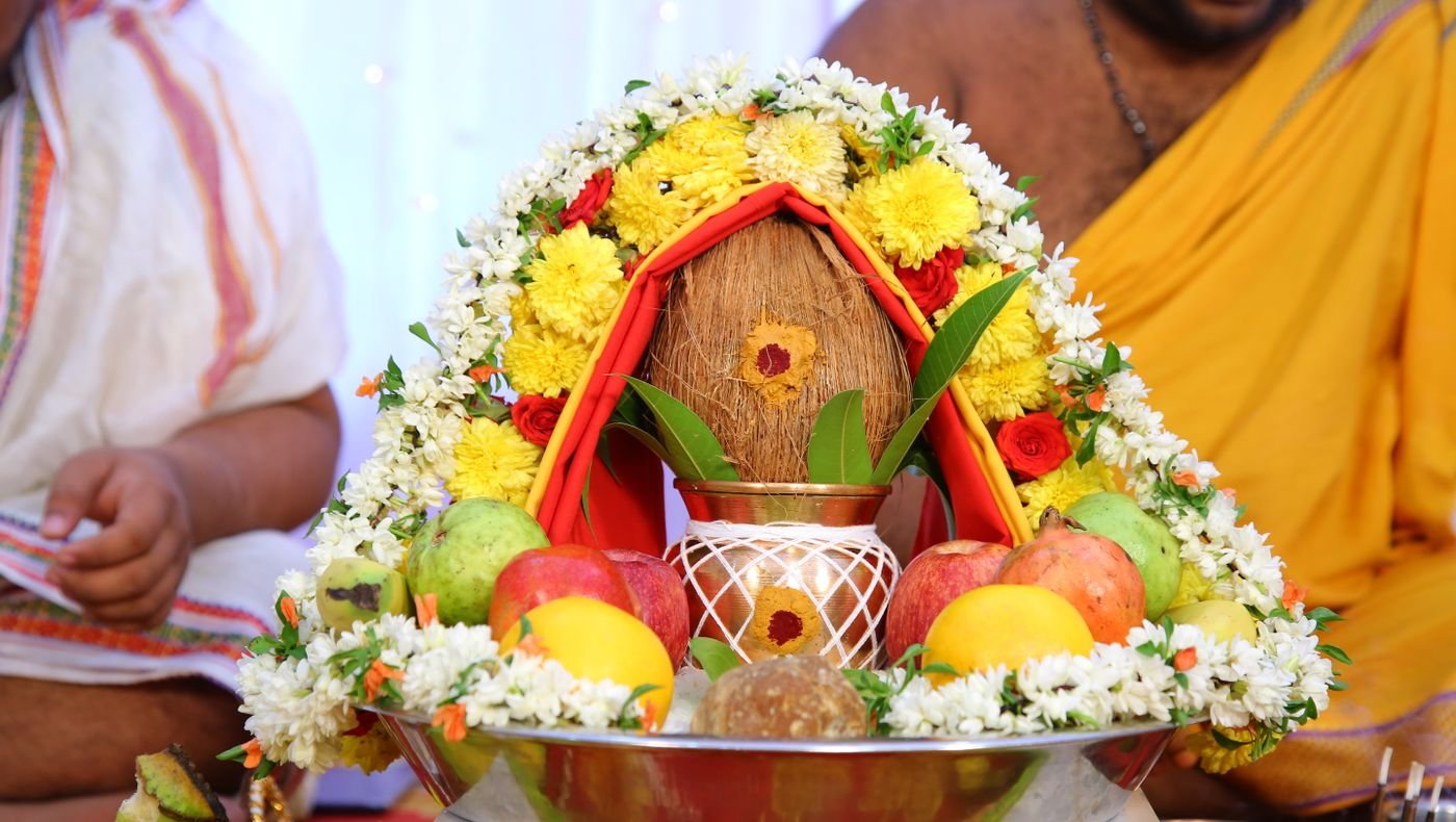 Bhumi Pujan ritual kalash with coconut, mango leaves, flowers and fruit offerings